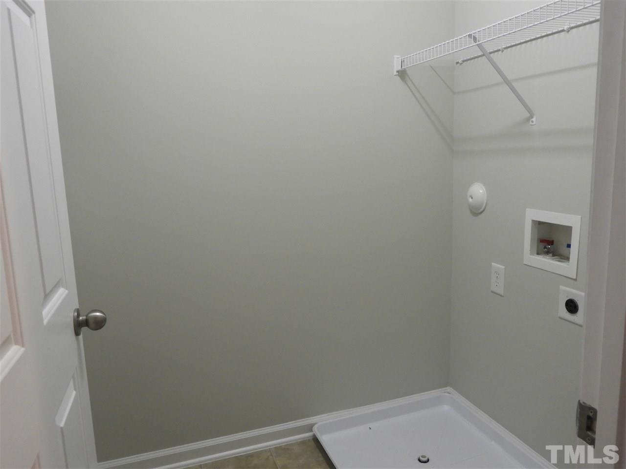 7245 Racine Way Raleigh, NC 27690 - Photo 24 of 29 a bathroom with a shower