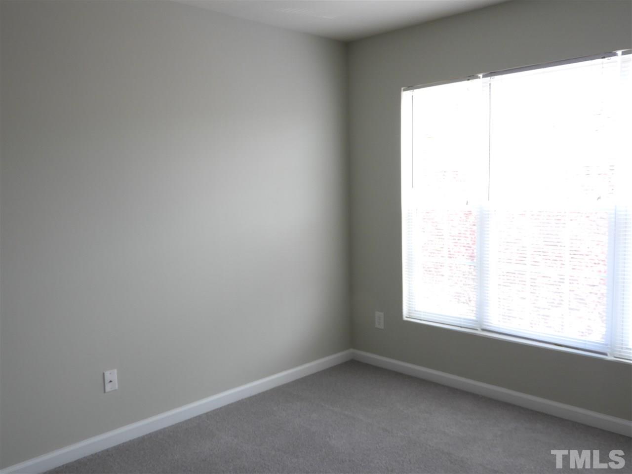 7245 Racine Way Raleigh, NC 27690 - Photo 27 of 29 an empty room with a window
