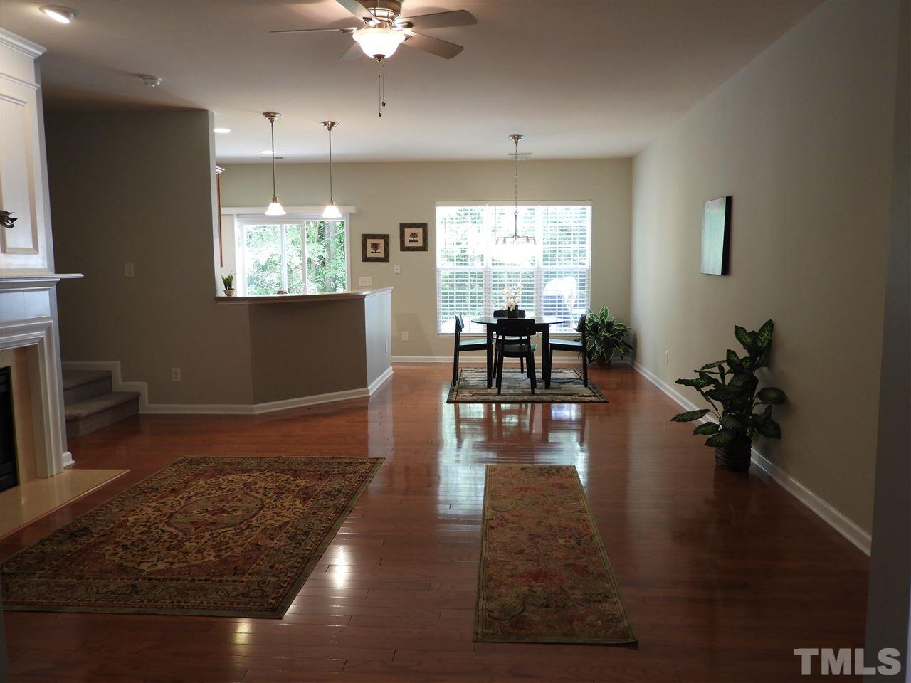 7245 Racine Way Raleigh, NC 27690 - Photo 5 of 29 a living room with furniture dining table and a large window