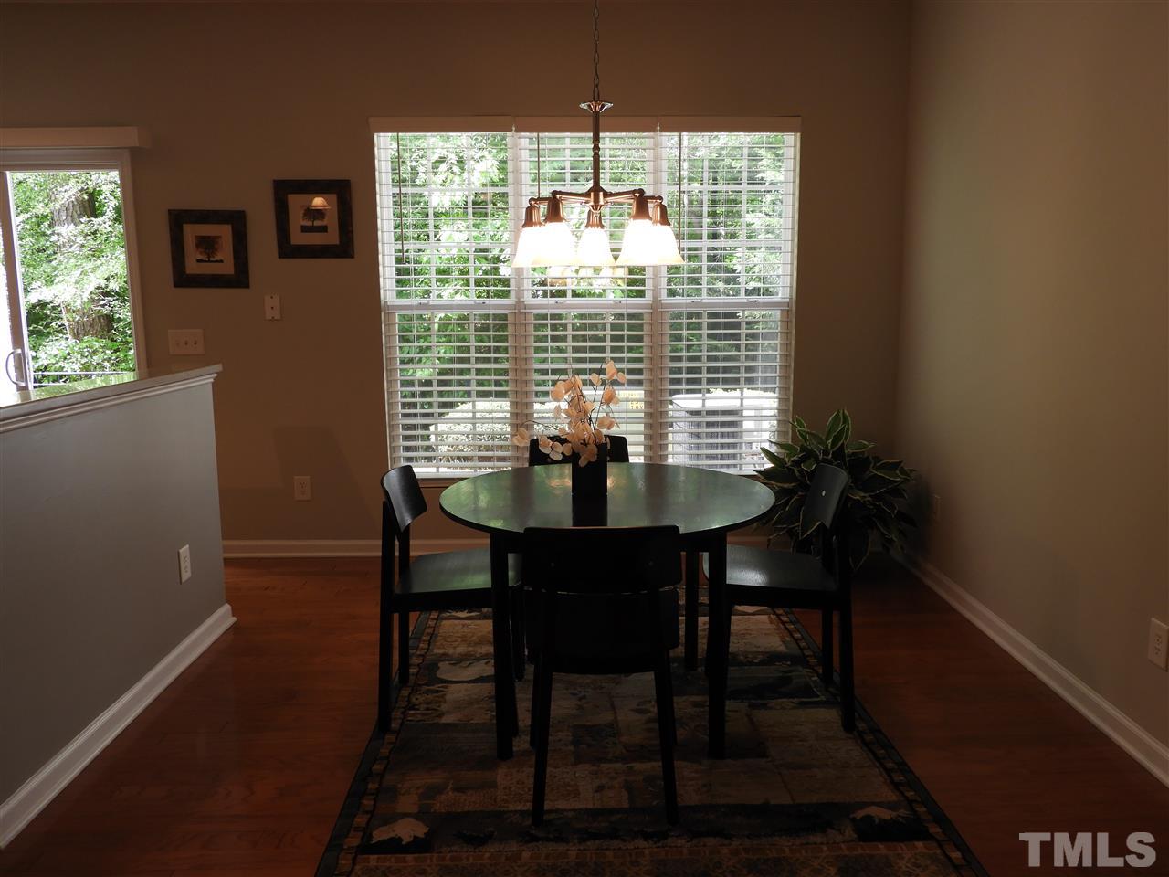 7245 Racine Way Raleigh, NC 27690 - Photo 8 of 29 a view of a dining room with furniture window and outside view