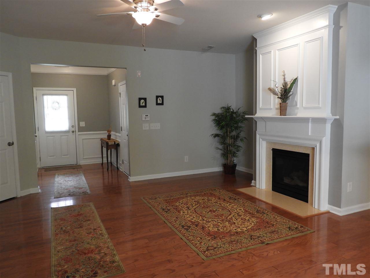 7245 Racine Way Raleigh, NC 27690 - Photo 9 of 29 a view of livingroom with furniture and fireplace