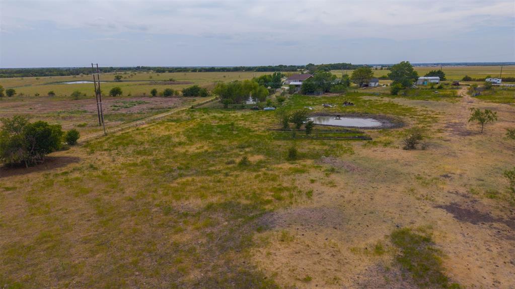0 Co Road Crandall, TX 75114 - Photo 11 of 14 Expansive rural property featuring a primary residence, multiple accessory structures, and a pond