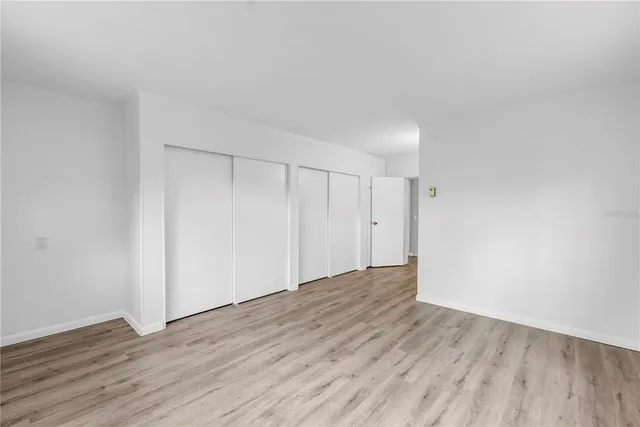 a bathroom with a sink mirror and toilet