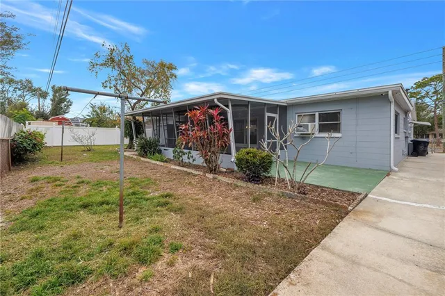 a view of a house with backyard and porch