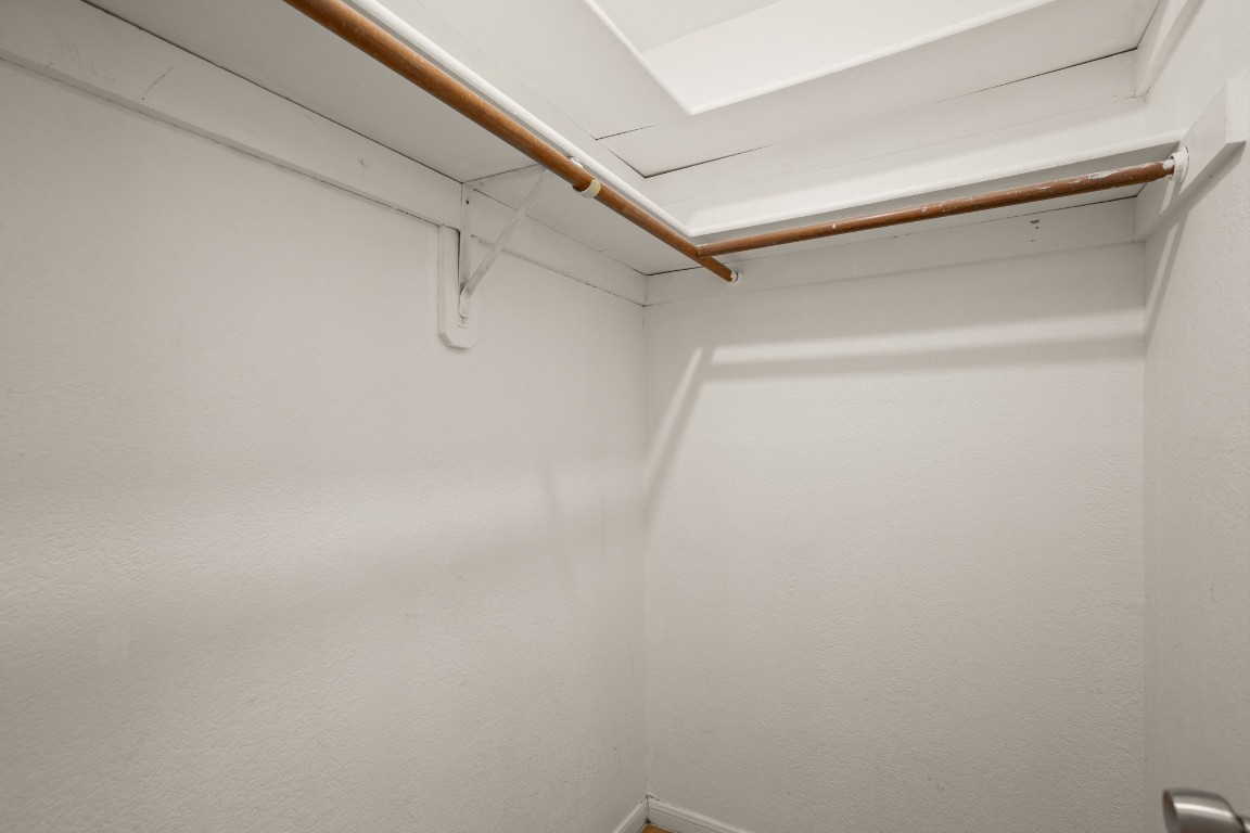 1013 West 23rd Street, Unit 105 Austin, TX 78705 - Photo 9 of 10 a view of a room with racks on the wall