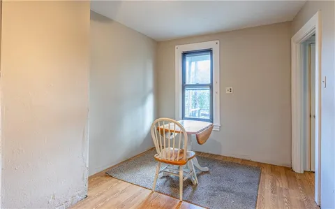 a room with chair and wooden floor
