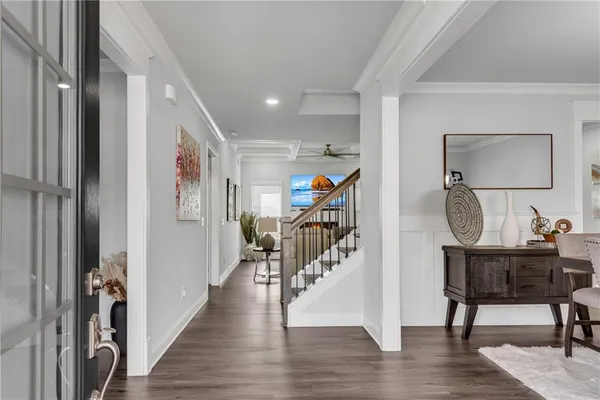 a view of an entryway with wooden floor