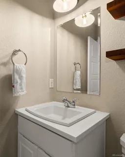 a bathroom with a sink and a mirror