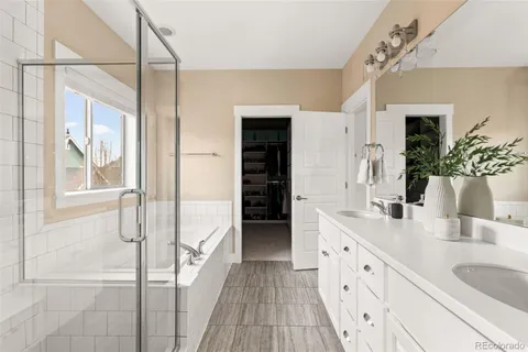 a bathroom with a granite countertop sink mirror and vanity