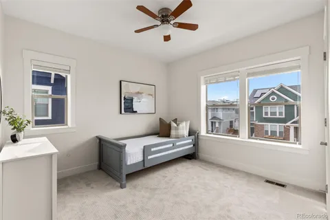 a living room with furniture and windows