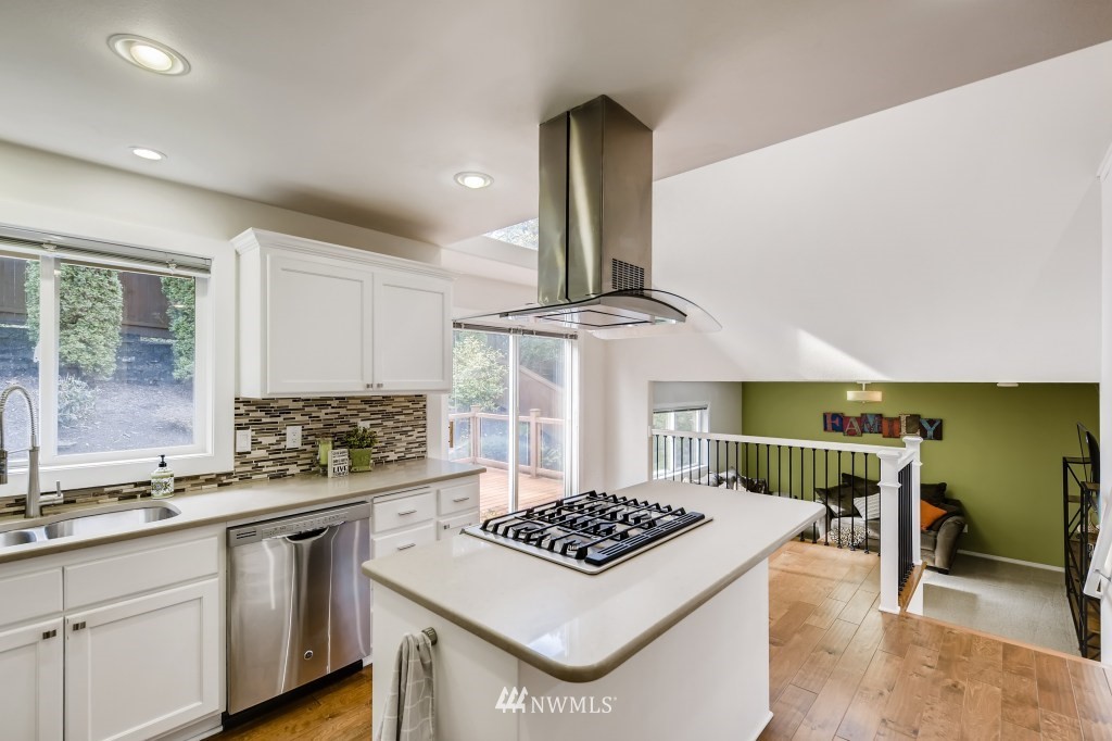 3306 201st Place Southeast Bothell, WA 98012 - Photo 11 of 28 a kitchen with a stove a sink and a refrigerator