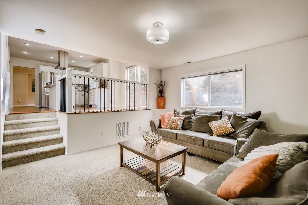 3306 201st Place Southeast Bothell, WA 98012 - Photo 16 of 28 a living room with furniture ceiling fan and a window