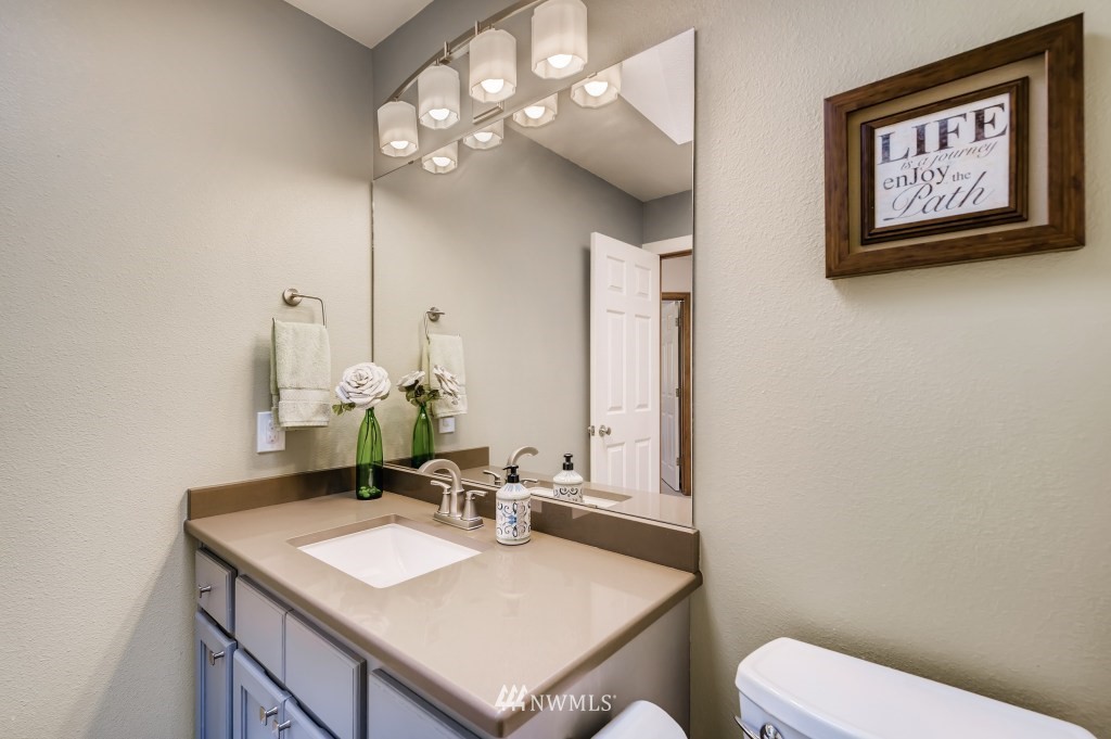 3306 201st Place Southeast Bothell, WA 98012 - Photo 21 of 28 a bathroom with a toilet sink and mirror