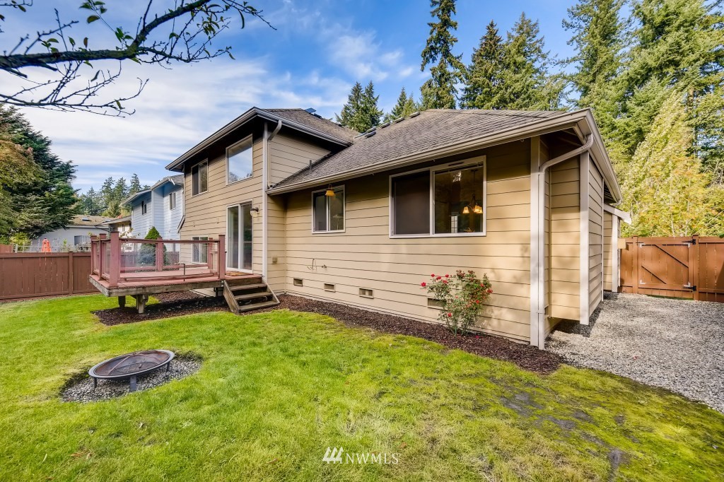 3306 201st Place Southeast Bothell, WA 98012 - Photo 26 of 28 a backyard of a house with table and chairs