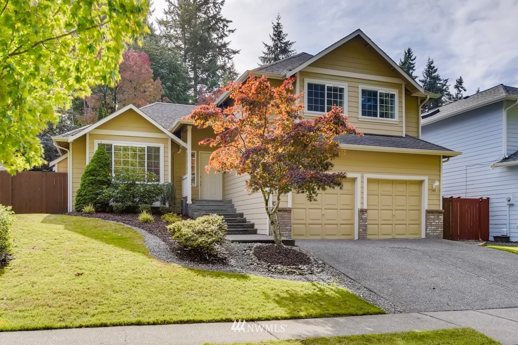 3306 201st Place Southeast Bothell, WA 98012 - Photo 27 of 28 a front view of a house with a yard