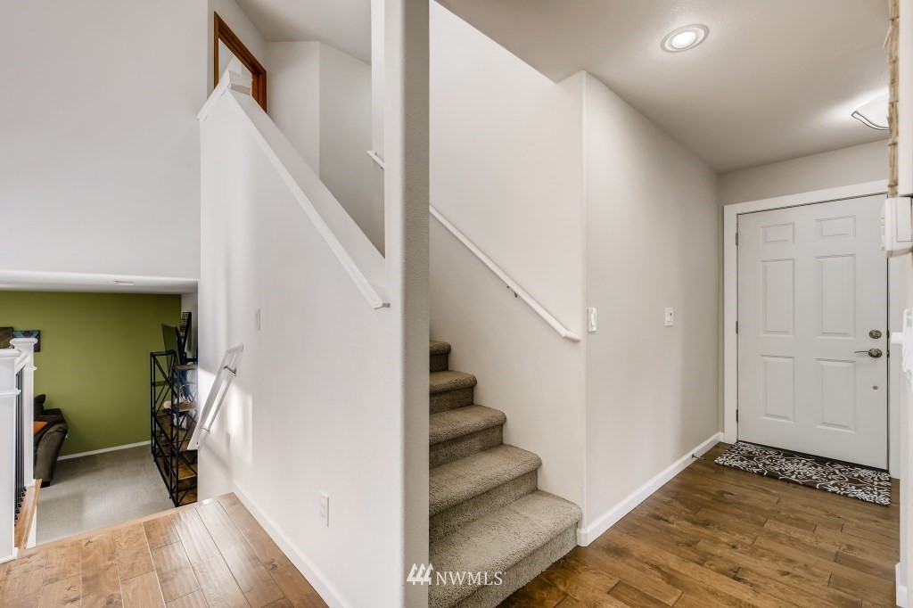 3306 201st Place Southeast Bothell, WA 98012 - Photo 7 of 28 a view of entryway and hall with wooden floor