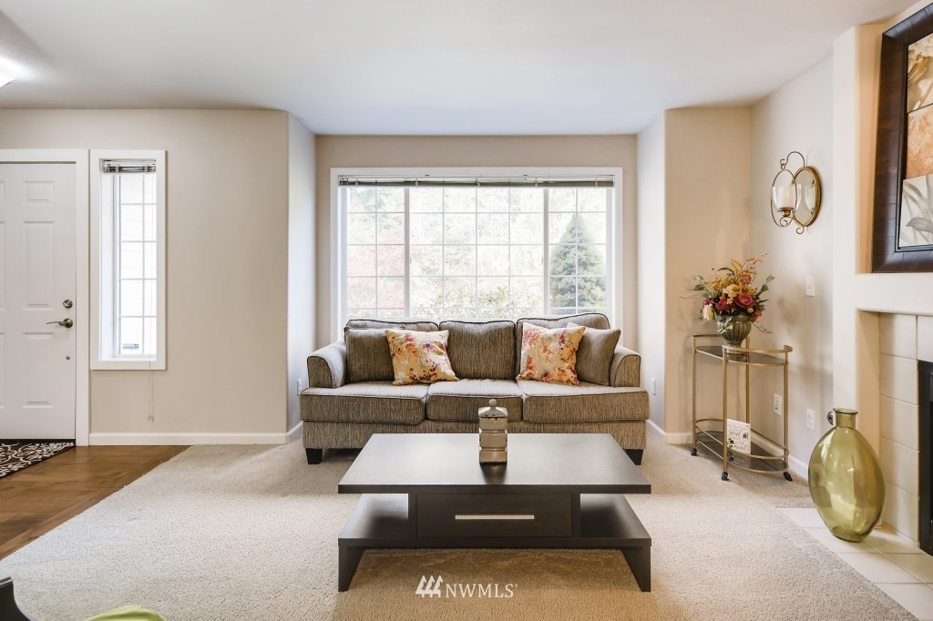 3306 201st Place Southeast Bothell, WA 98012 - Photo 9 of 28 a living room with furniture and a window