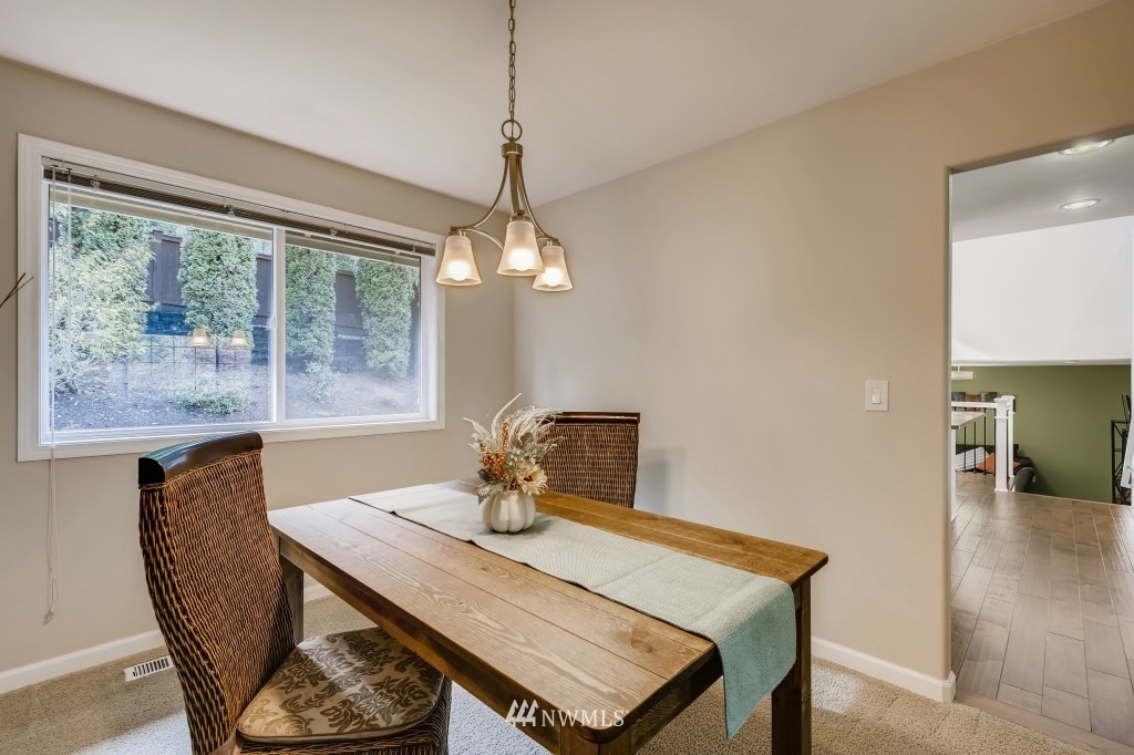 3306 201st Place Southeast Bothell, WA 98012 - Photo 10 of 28 a view of a dining room with furniture window and outside view
