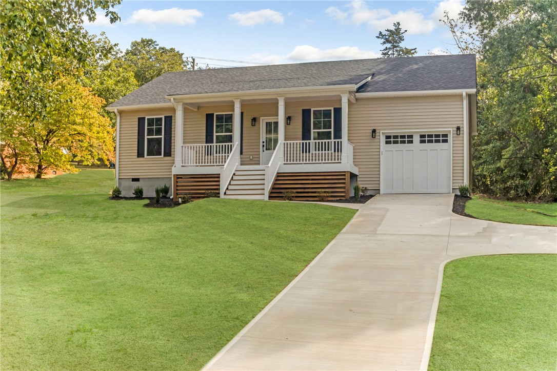 1115 Marshall Road Anderson, SC 29626 - Photo 1 of 35 An inviting front porch welcomes you to this classic ranch-style home with vinyl siding.