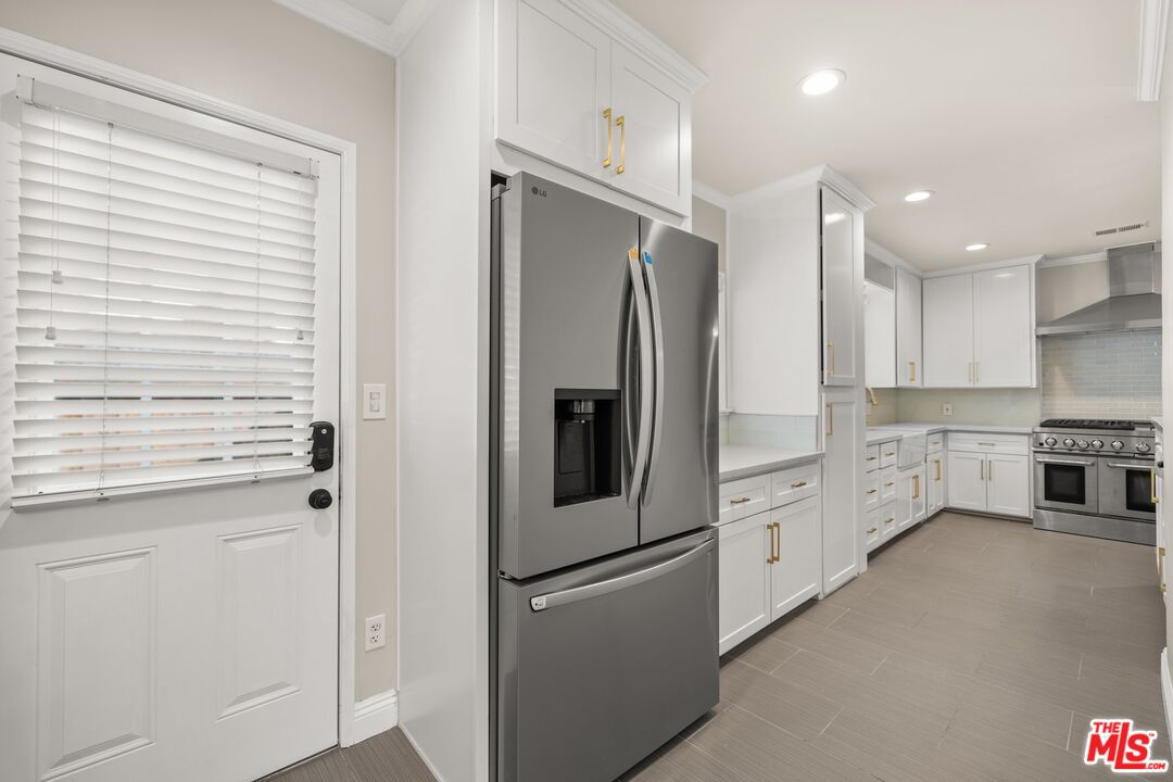 529 Coolidge Drive San Gabriel, CA 91775 - Photo 6 of 11 a kitchen with stainless steel appliances a refrigerator sink and stove