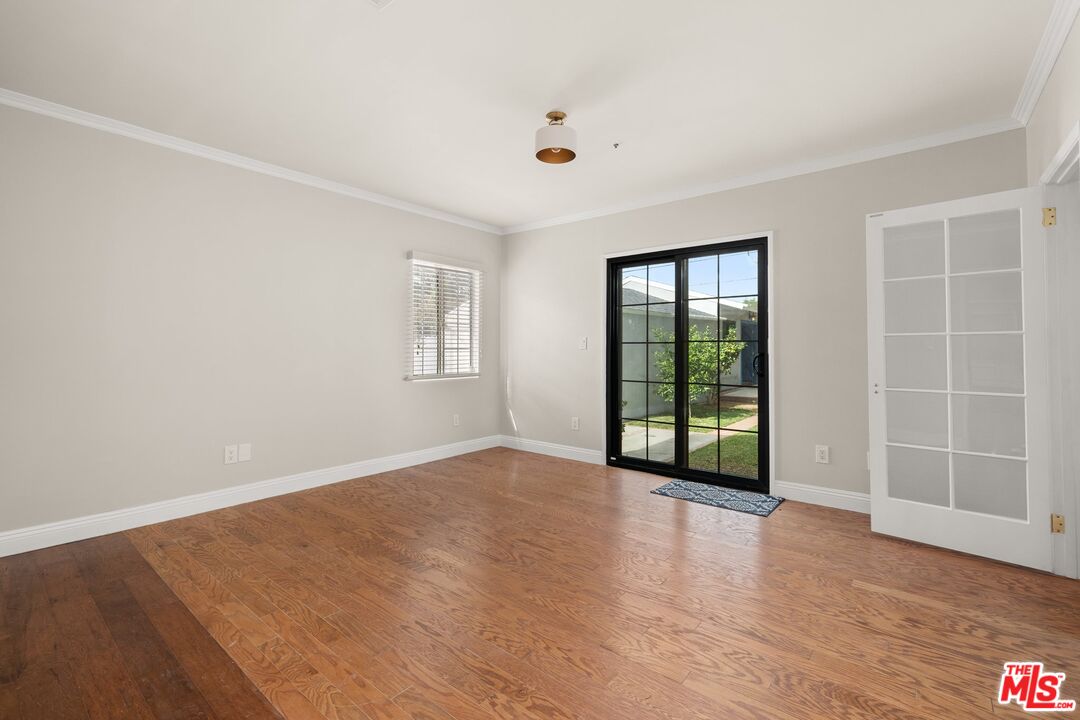 529 Coolidge Drive San Gabriel, CA 91775 - Photo 10 of 11 an empty room with wooden floor and windows