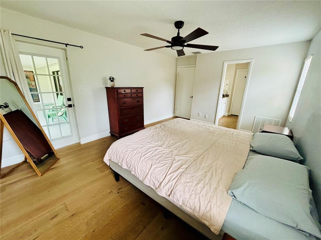 1045 Shaffer Trail Oviedo, FL 32765 - Photo 15 of 30 a bedroom with a bed and a dresser