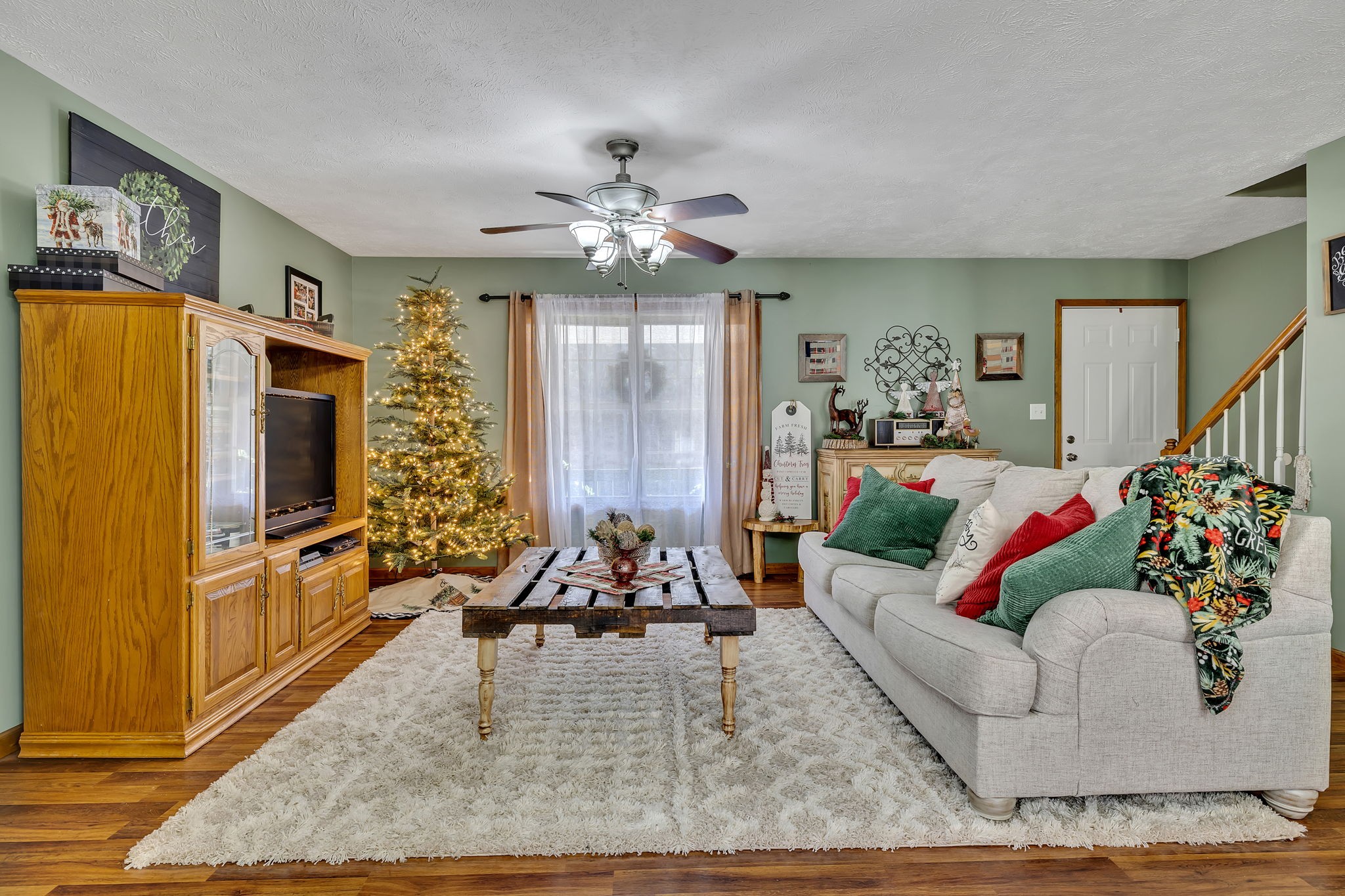 293 Slippery Road Hohenwald, TN 38462 - Photo 12 of 36 a living room with furniture fireplace and flat screen tv