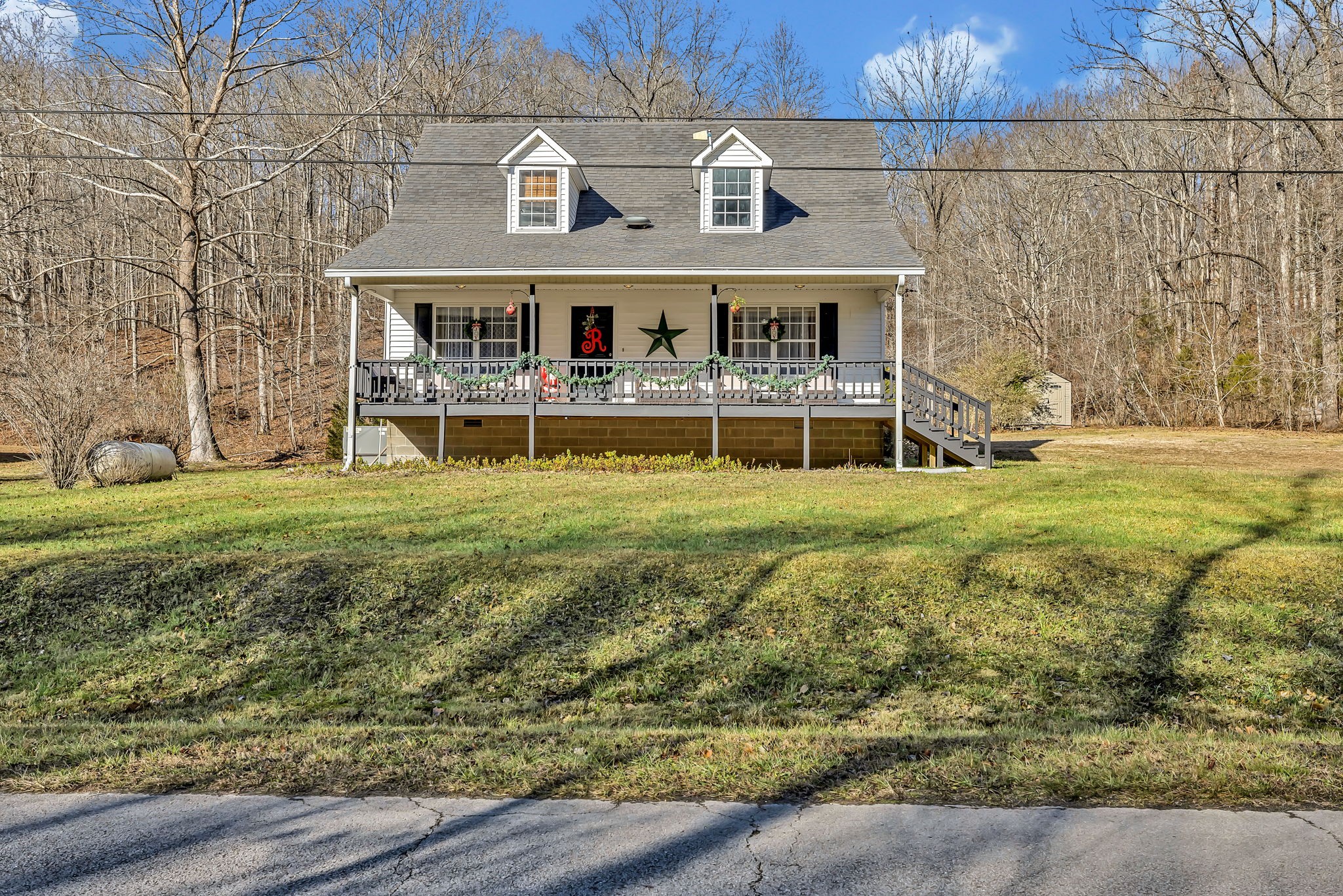 293 Slippery Road Hohenwald, TN 38462 - Photo 2 of 36 a view of building with yard
