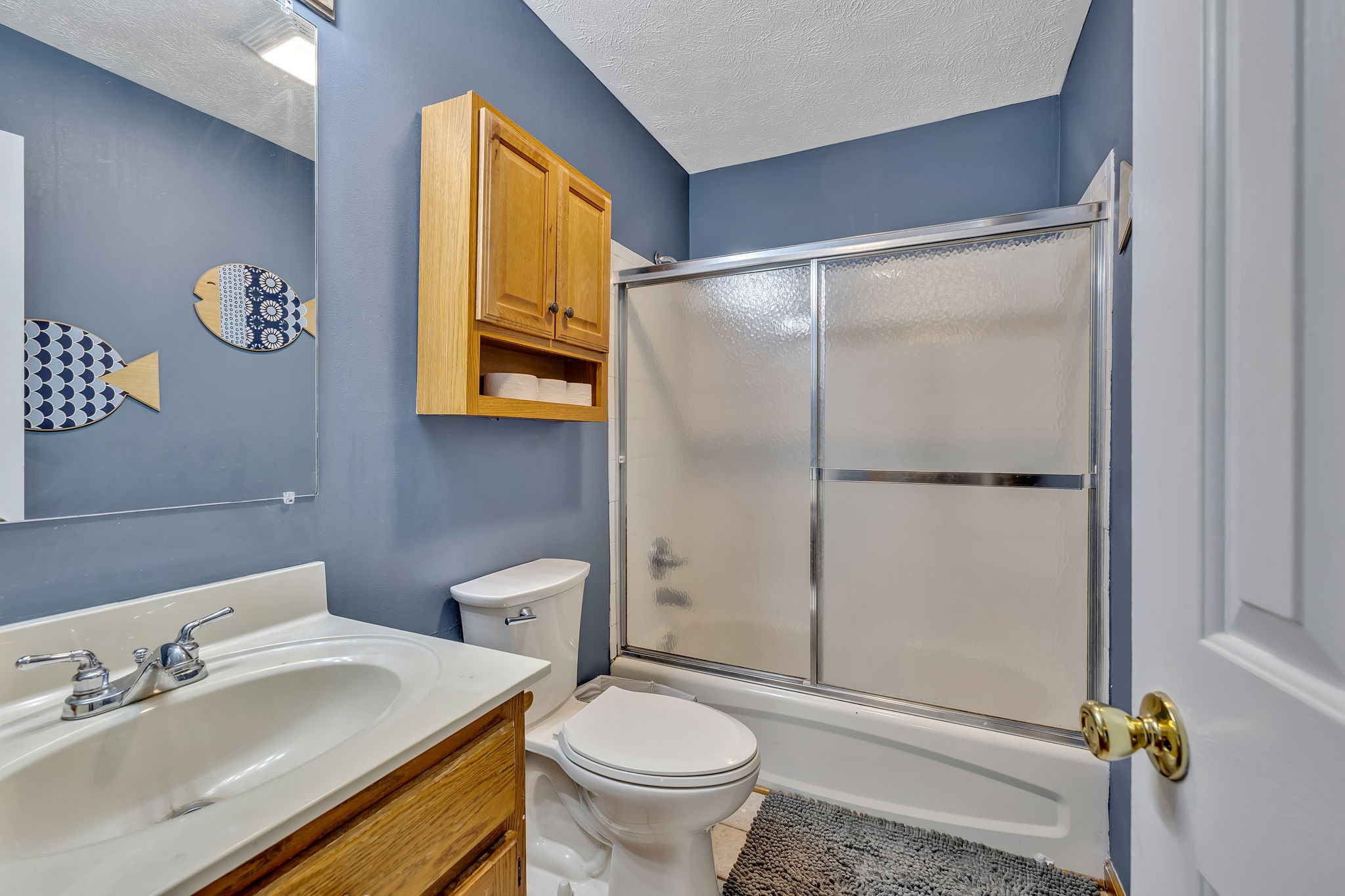293 Slippery Road Hohenwald, TN 38462 - Photo 23 of 36 a bathroom with a toilet a sink and a mirror