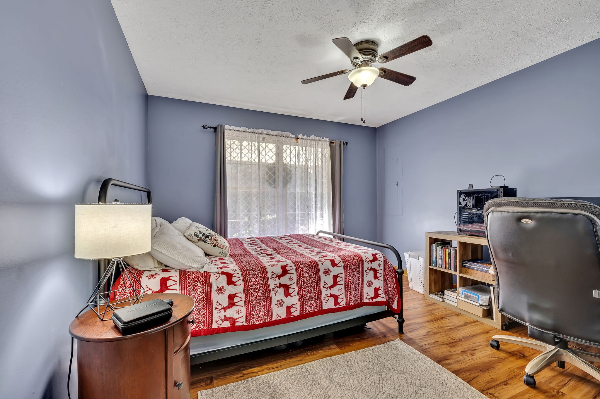 293 Slippery Road Hohenwald, TN 38462 - Photo 24 of 36 a bedroom with a bed and wooden floor