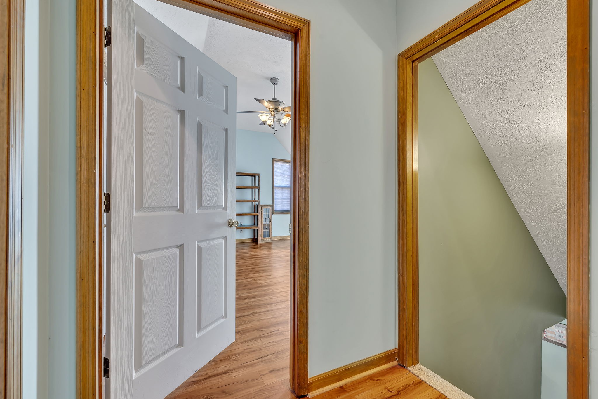 293 Slippery Road Hohenwald, TN 38462 - Photo 25 of 36 a view of a hallway with wooden floor and entryway