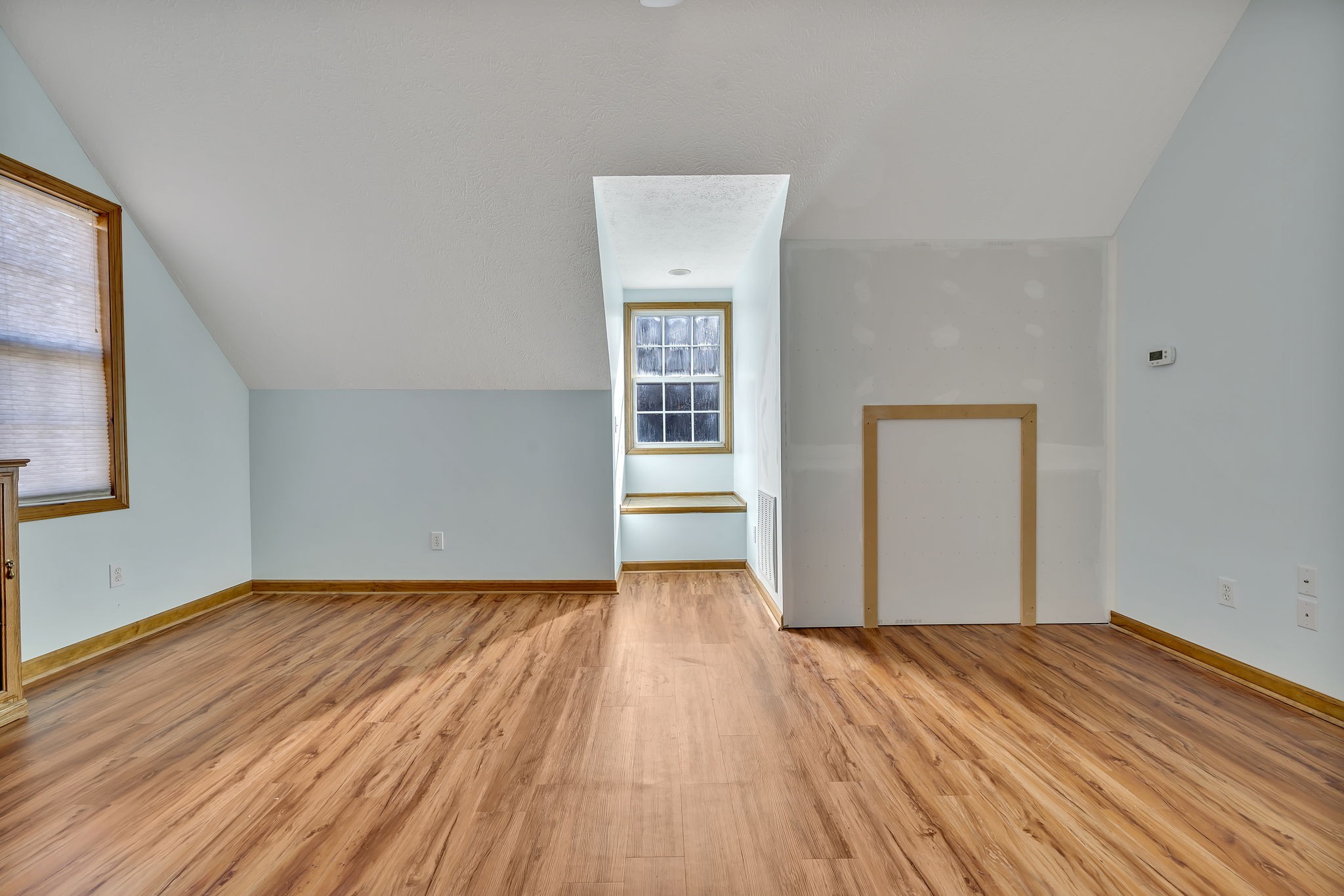 293 Slippery Road Hohenwald, TN 38462 - Photo 27 of 36 a view of a room with wooden floor and window
