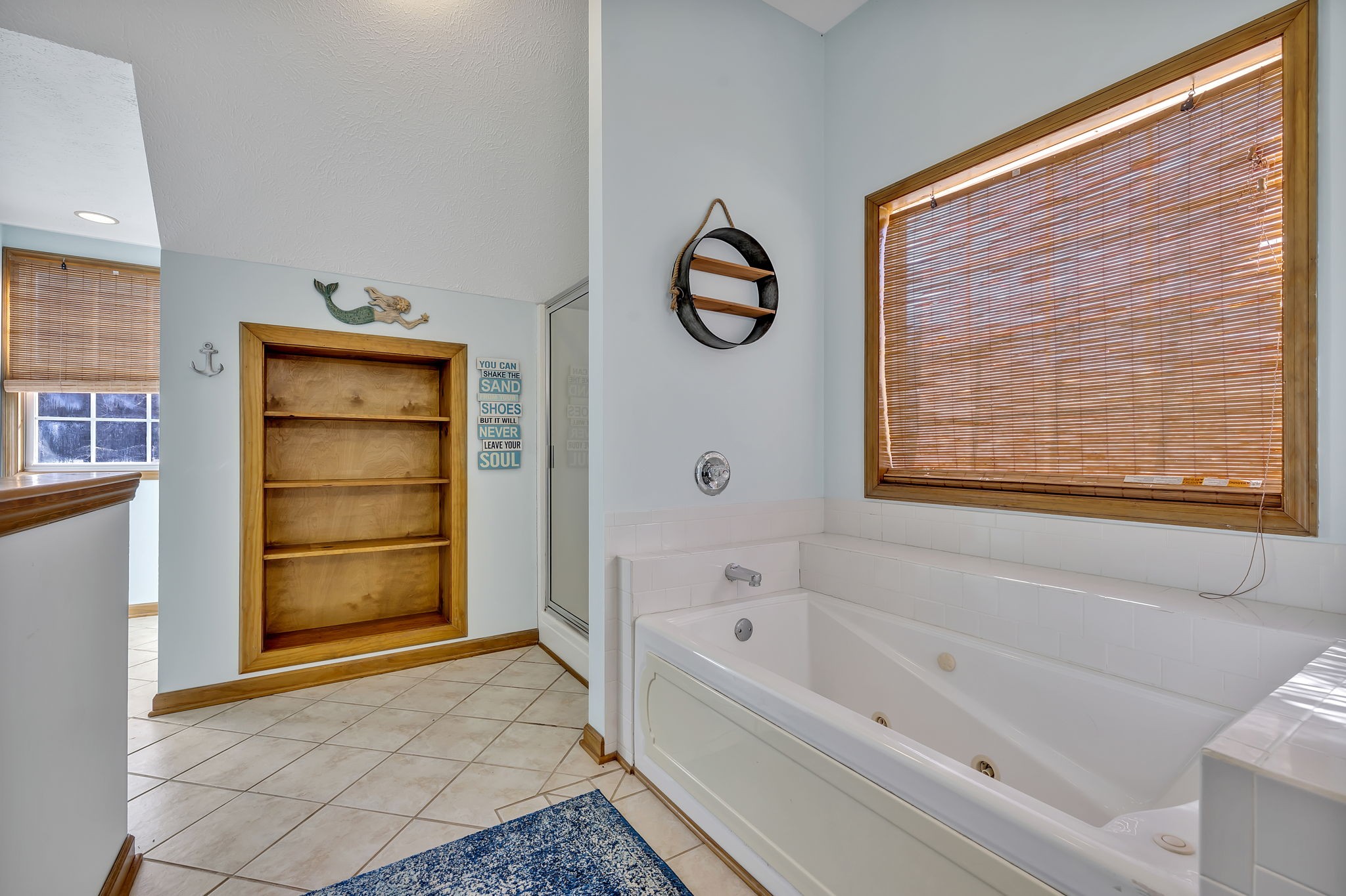 293 Slippery Road Hohenwald, TN 38462 - Photo 31 of 36 a bathroom with a bathtub and a shower
