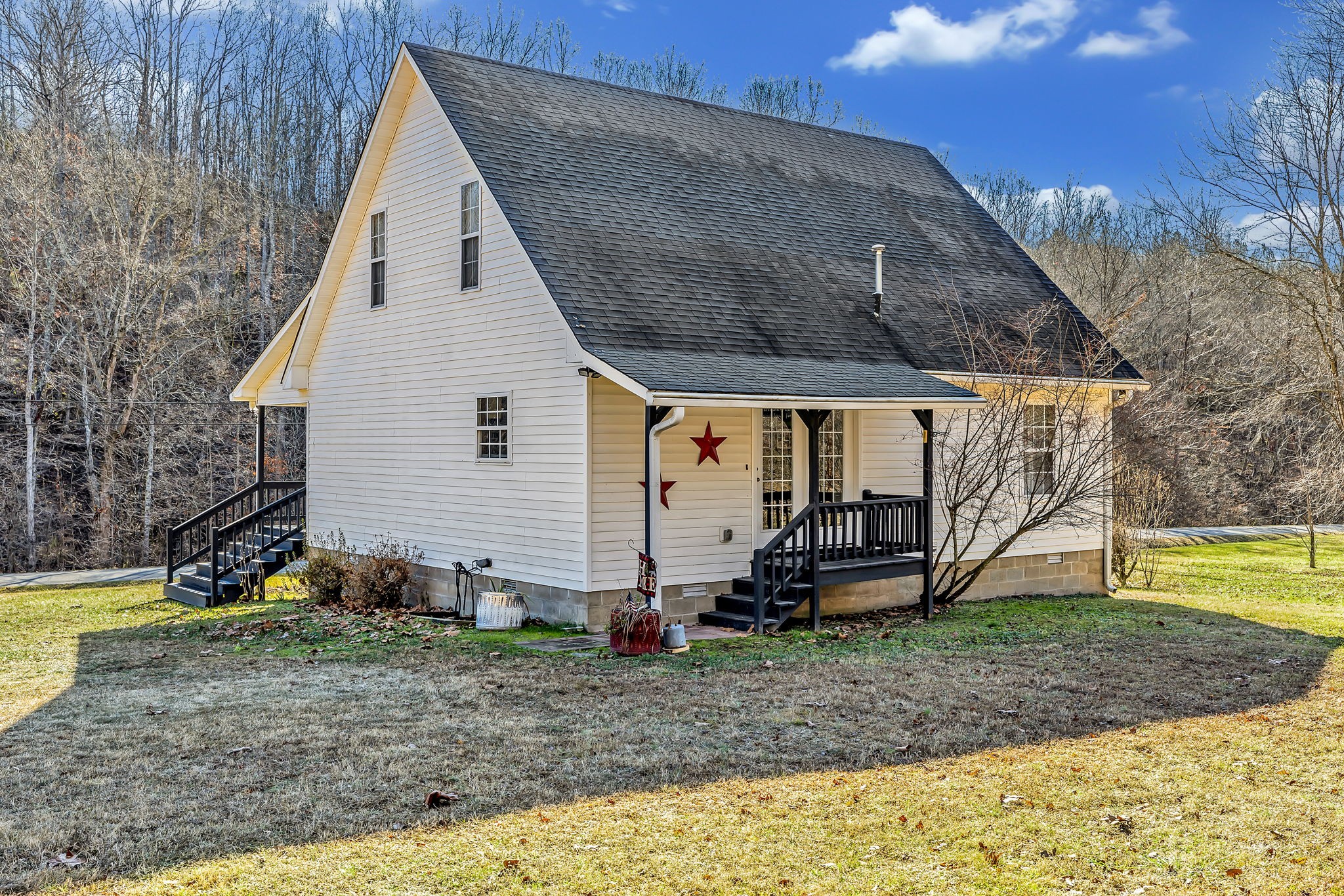 293 Slippery Road Hohenwald, TN 38462 - Photo 32 of 36 a view of a house with backyard and garden