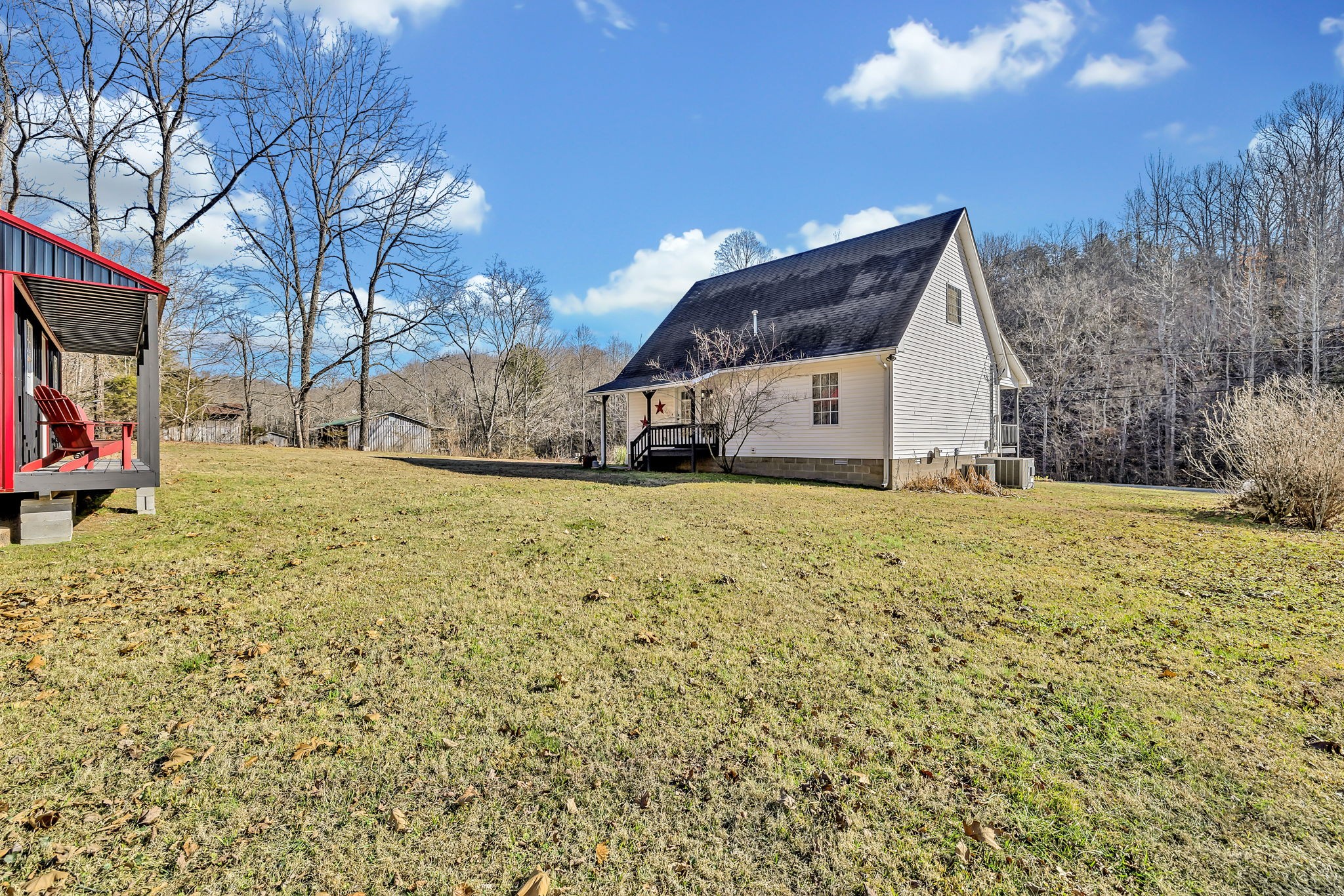 293 Slippery Road Hohenwald, TN 38462 - Photo 34 of 36 a view of a house with a yard