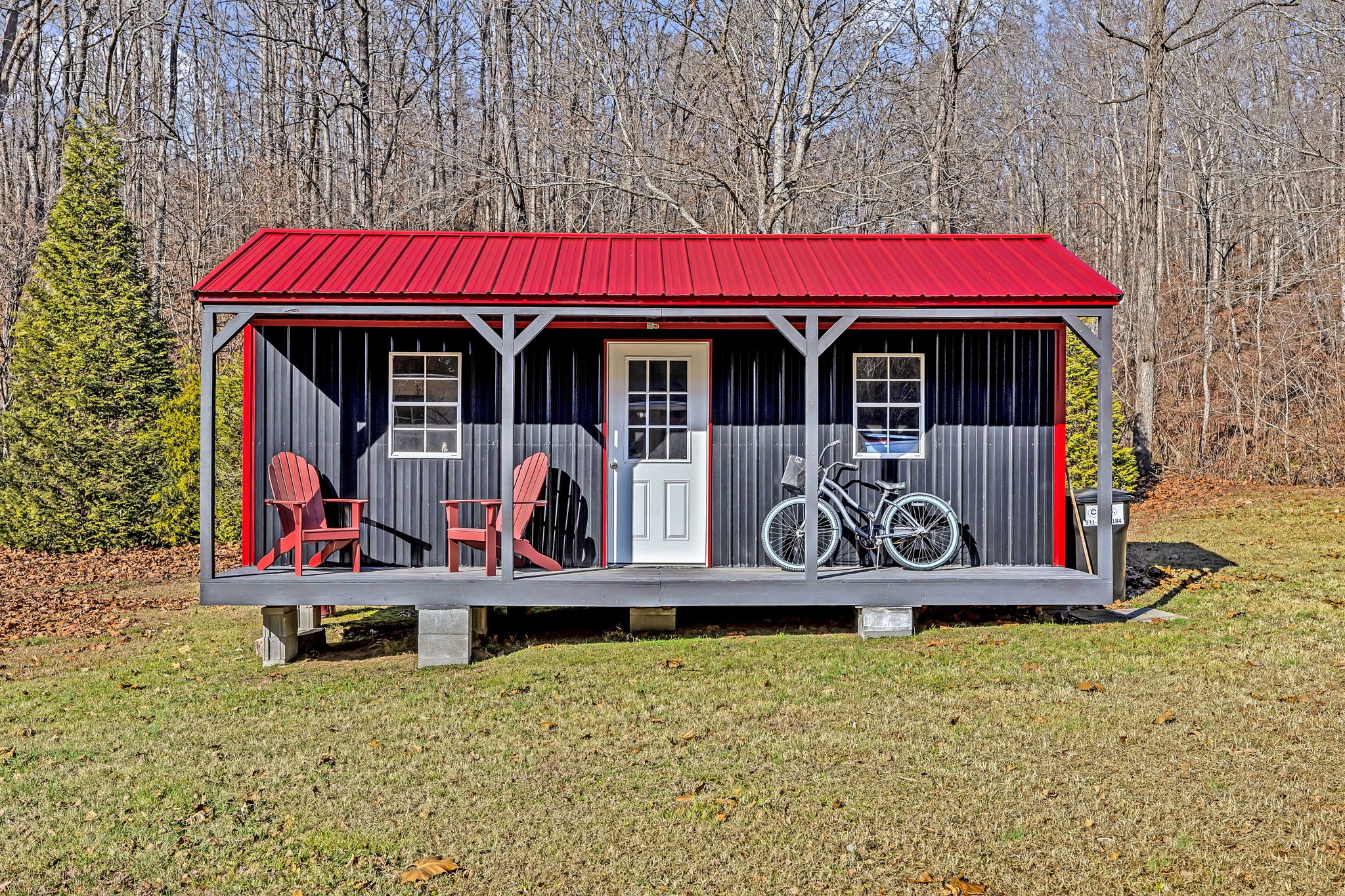 293 Slippery Road Hohenwald, TN 38462 - Photo 36 of 36 a front view of a house with garden