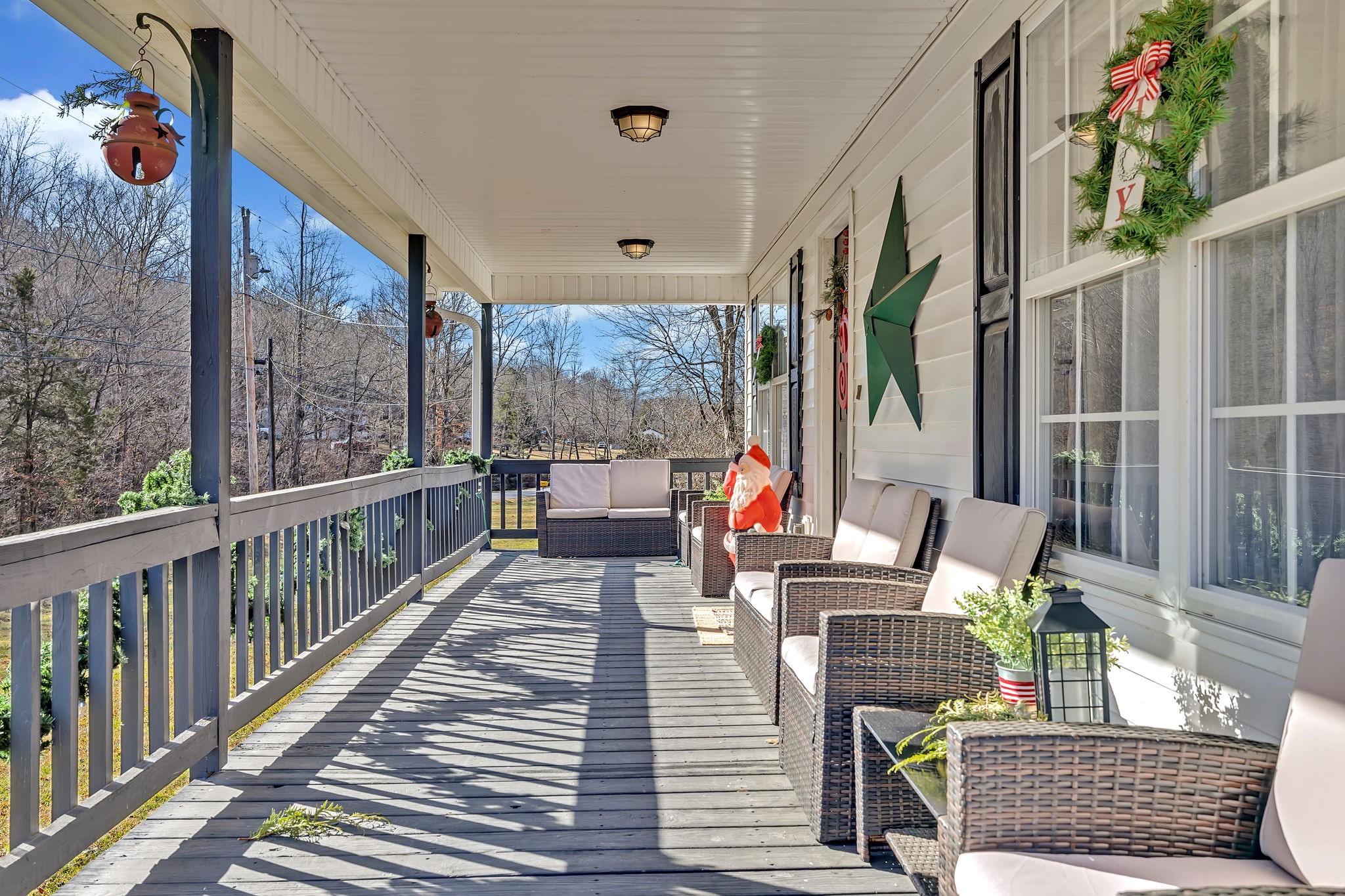 293 Slippery Road Hohenwald, TN 38462 - Photo 7 of 36 a balcony view with couple of chairs and wooden floor
