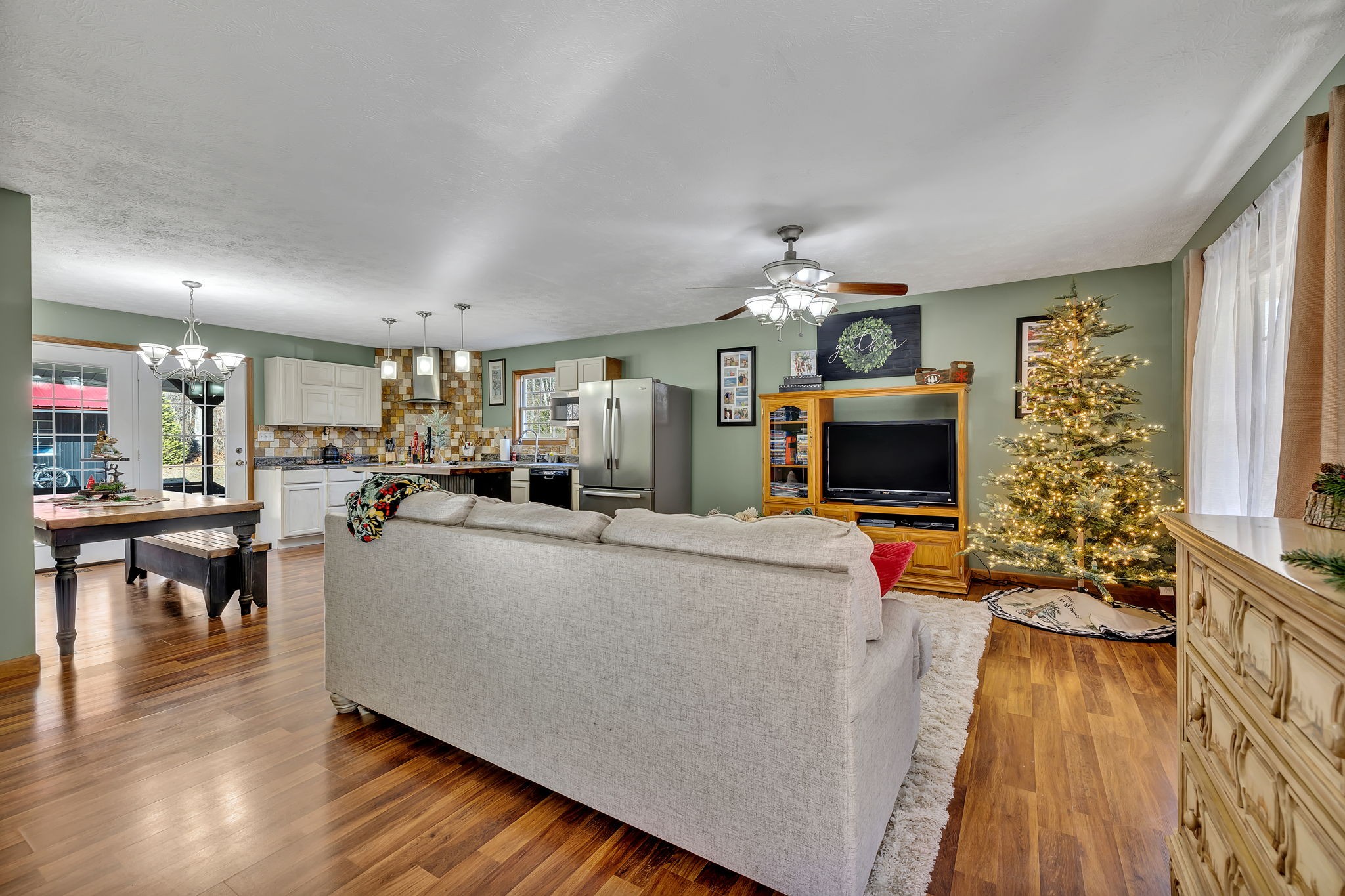 293 Slippery Road Hohenwald, TN 38462 - Photo 10 of 36 a living room with furniture and a flat screen tv
