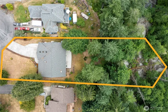 an aerial view of residential house with outdoor space and swimming pool
