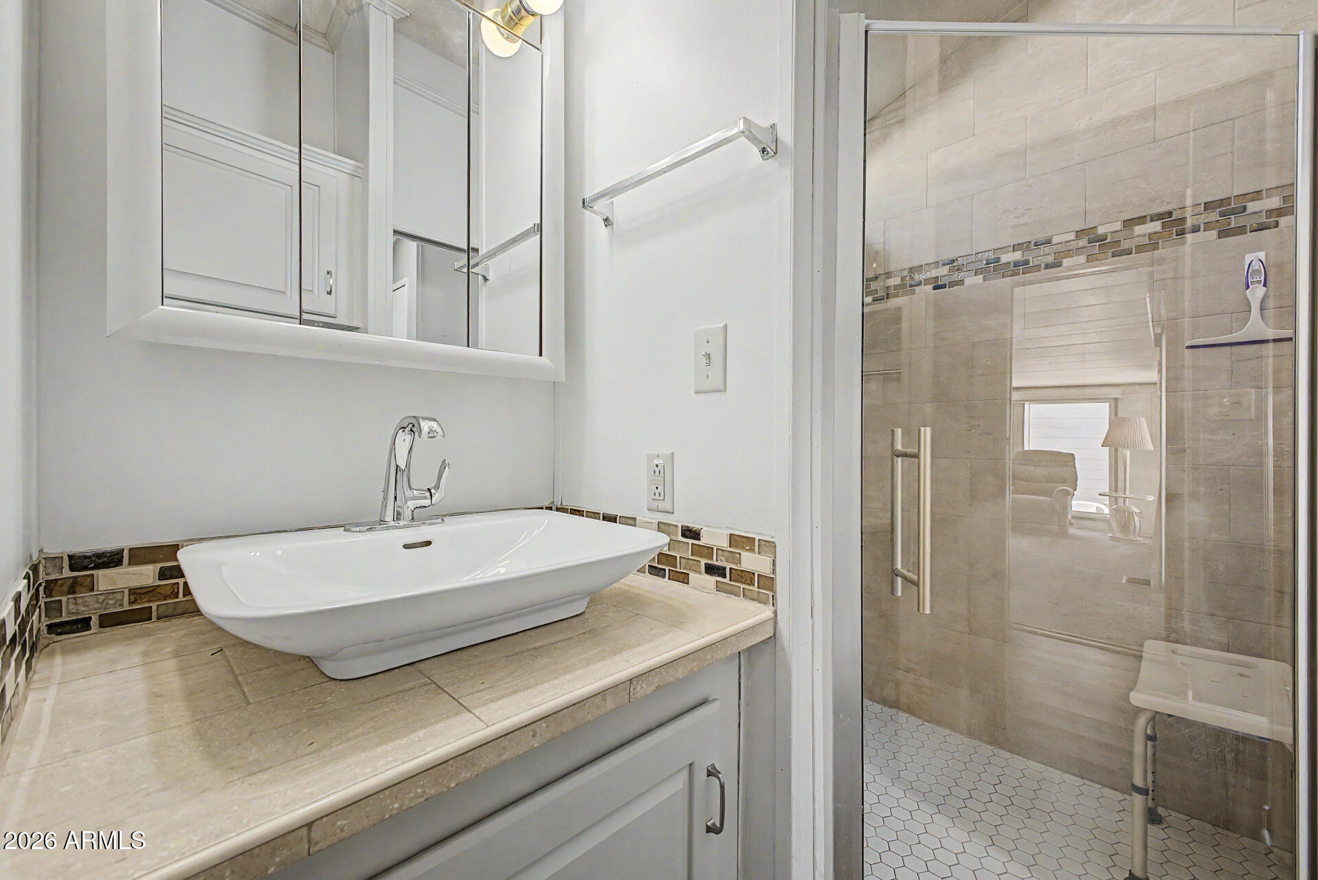 7750 East Broadway Road, Unit 560 Mesa, AZ 85208 - Photo 11 of 18 a bathroom with a sink and mirror