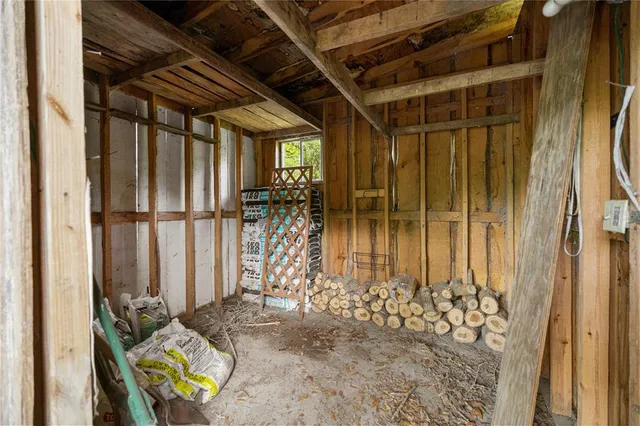 an aerial view of a house with swimming pool and ocean view