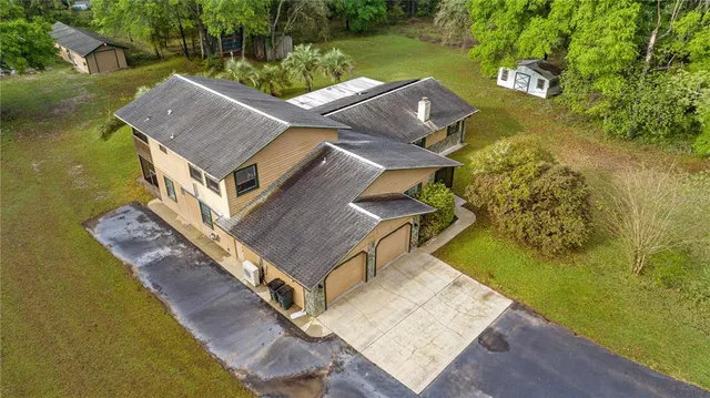 a large kitchen with stainless steel appliances a refrigerator and a counter top space
