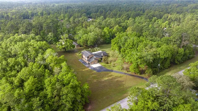 a kitchen with a refrigerator and a sink