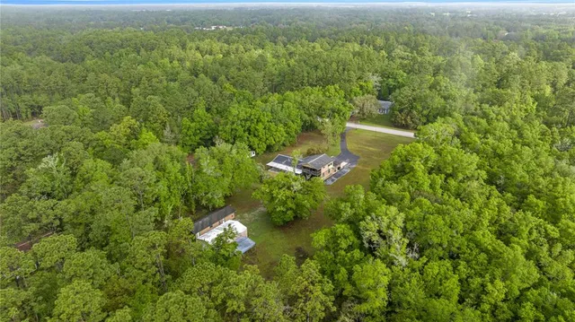 a kitchen with a refrigerator and a stove