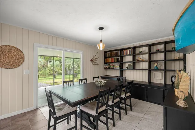 a bedroom with a bed wooden floor and a table