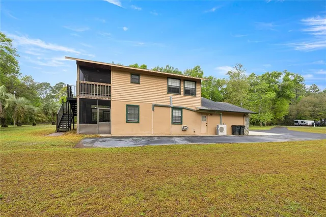 a view of a house with a big yard