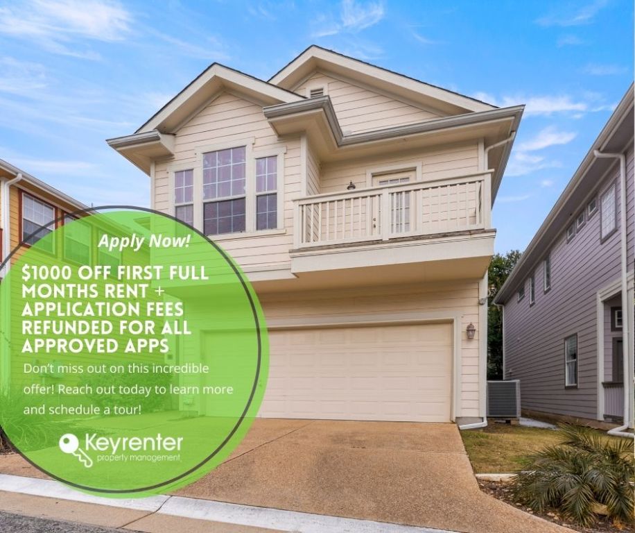 a view of a white house with a swimming pool