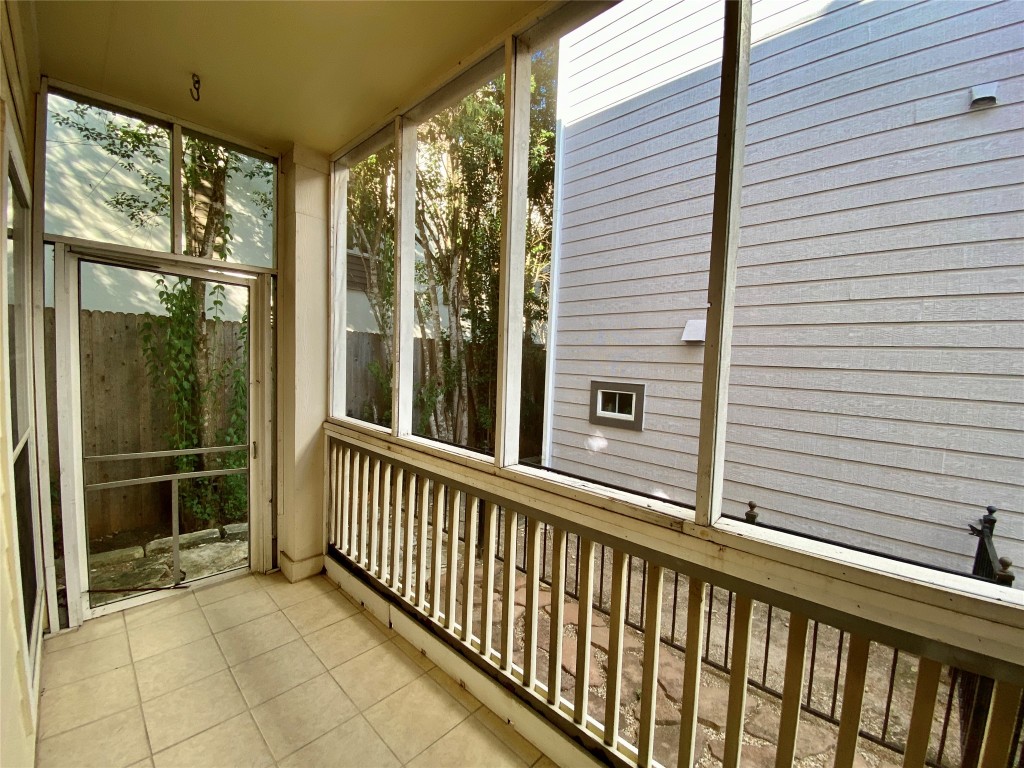 6704 Menchaca Road, Unit 8 Austin, TX 78745 - Photo 13 of 39 a view of a balcony with a potted plant