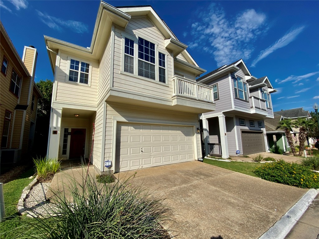 6704 Menchaca Road, Unit 8 Austin, TX 78745 - Photo 2 of 39 a front view of a house with a yard