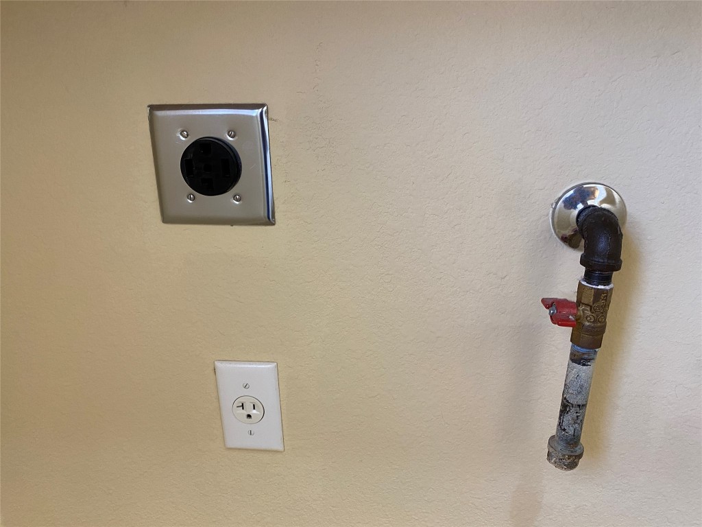 6704 Menchaca Road, Unit 8 Austin, TX 78745 - Photo 20 of 39 a close view of a faucet a sink and a utility room